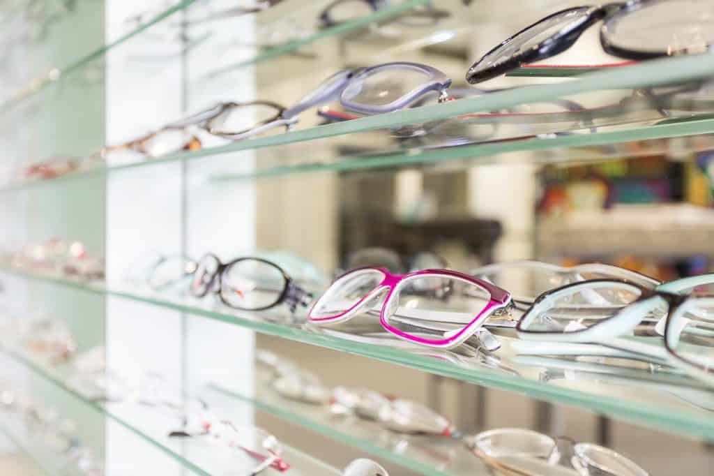 Prescription glasses on a shelf.